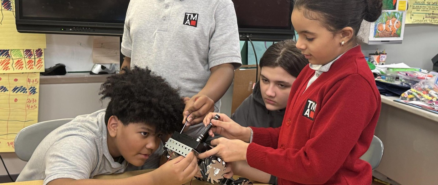Students working with robotics